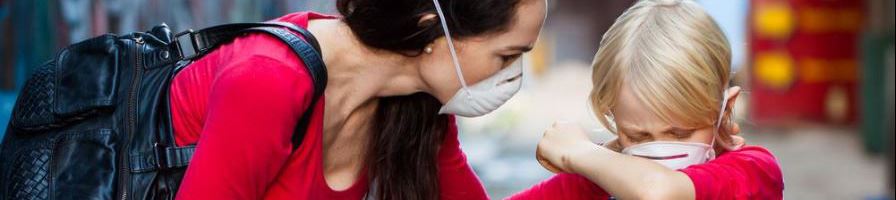 Mother and Child With Masks On Their Face