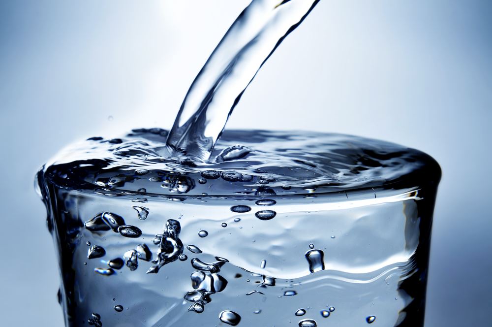 Water Being Poured Into a Glass