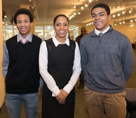 Image of three youth, two male, one female.