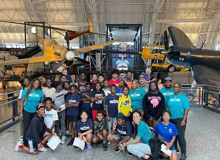 group picture inside the College Park Aviation Museum with model airplanes