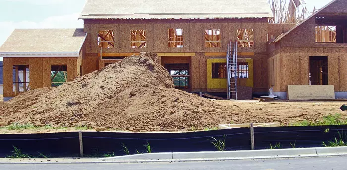 Site development inspection with erosion barrier set up during construction