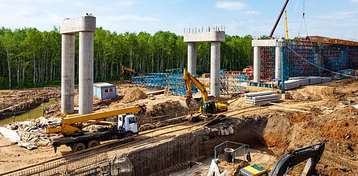 Traffic Engineering photo of extensive road project with stabilization and overpass pillars