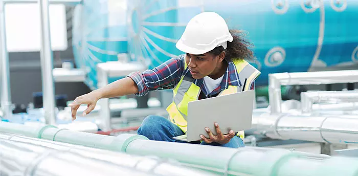 Water and sewer inspection, female inspector inspects pipes