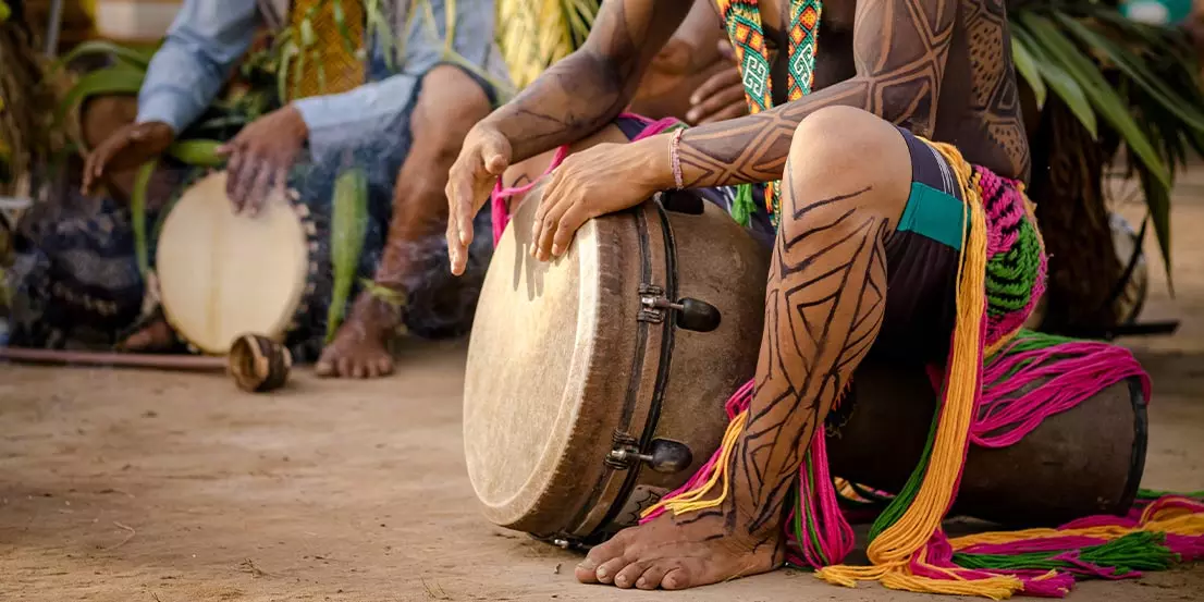 indigenous people playing drums