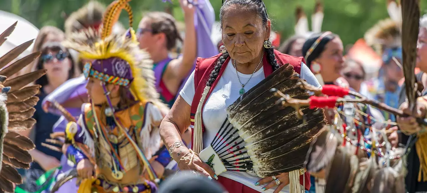 Native American elders and community at a festival