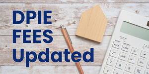 DPIE Fees Updated, photo of pencil, wood house cutout and calculator