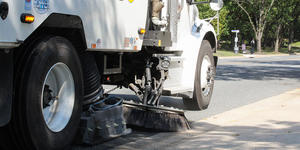 side of street sweeper in action