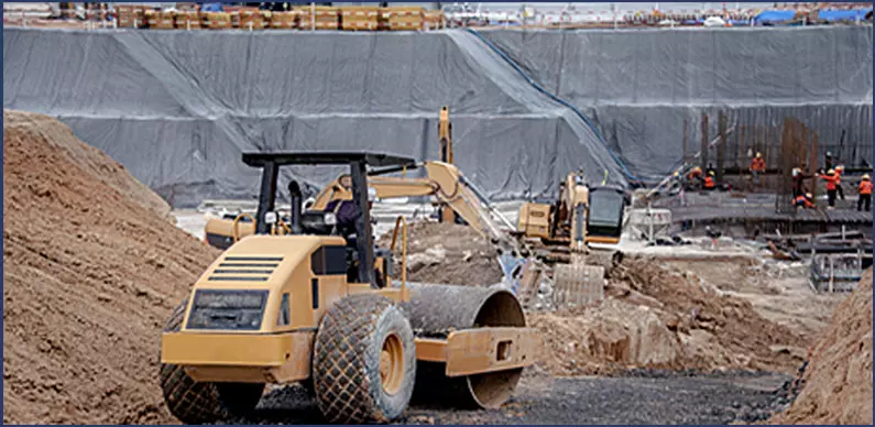 New Site Road Construction Fees, photo of road work and bldg of supports