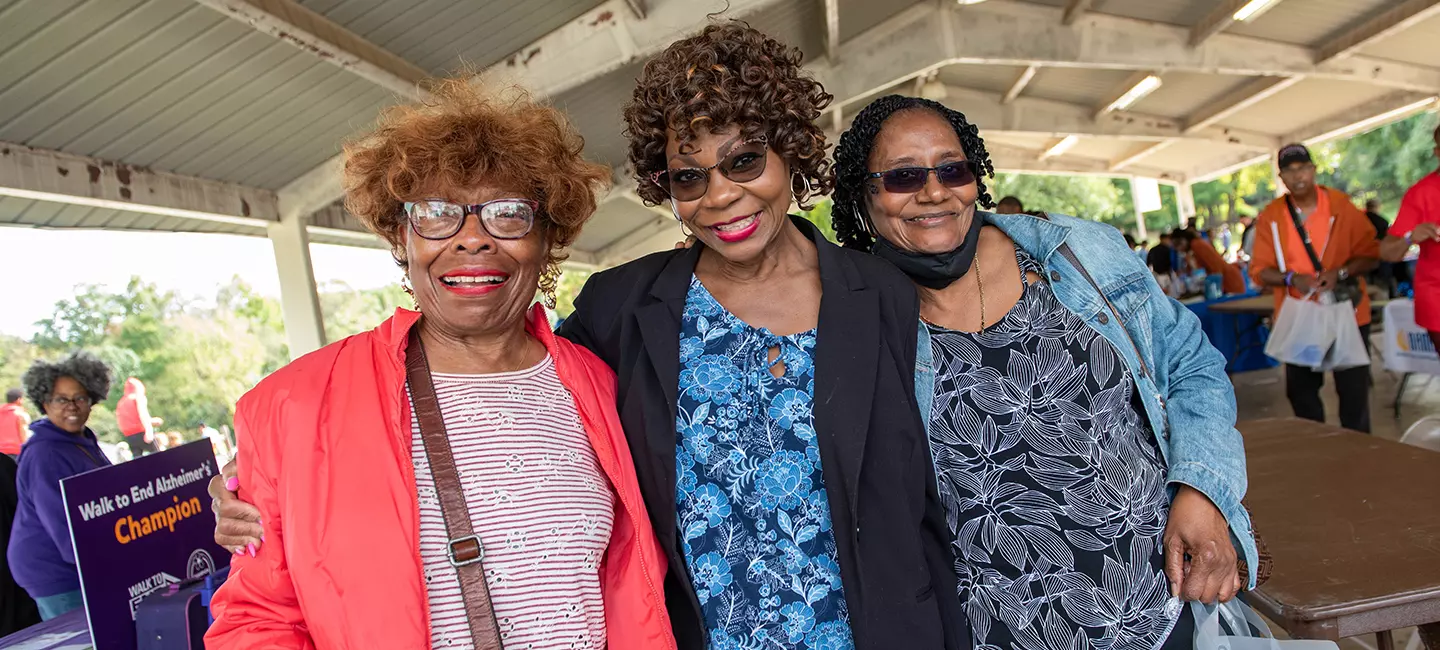 Smiling seniors at County picnic