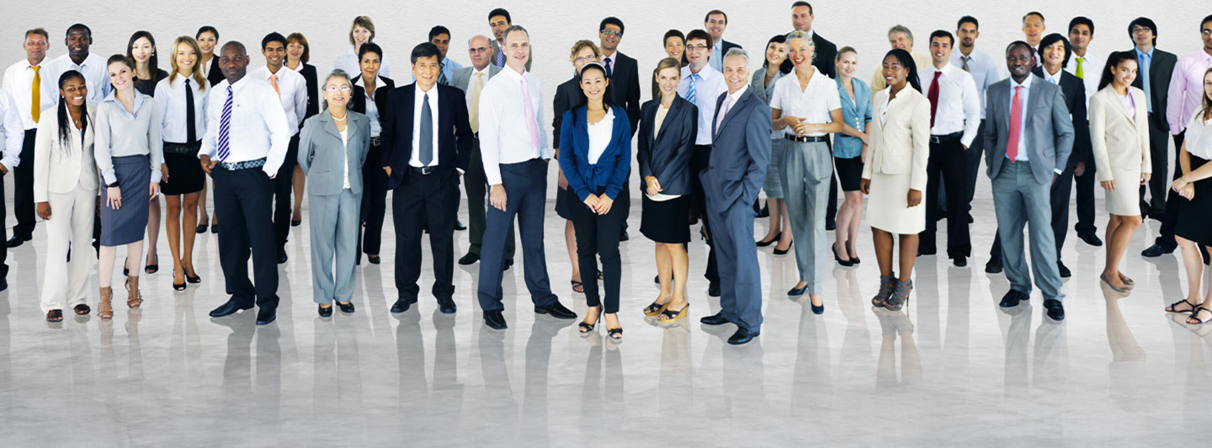 group of diverse professionals standing in work clothing